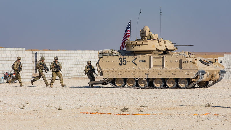 U.S. Soldiers in the 4th Battalion, 118th Infantry Regiment, 30th Armored Brigade Combat Team, North Carolina Army National Guard, attached to the 218th Maneuver Enhancement Brigade, South Carolina Army National Guard, on maneuvers in eastern Syria.