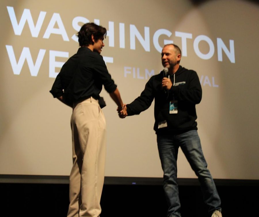 Johnathan Kirkpatrick receives the Best Film award from Washington West Film Festival Executive Director Brad Russell. 