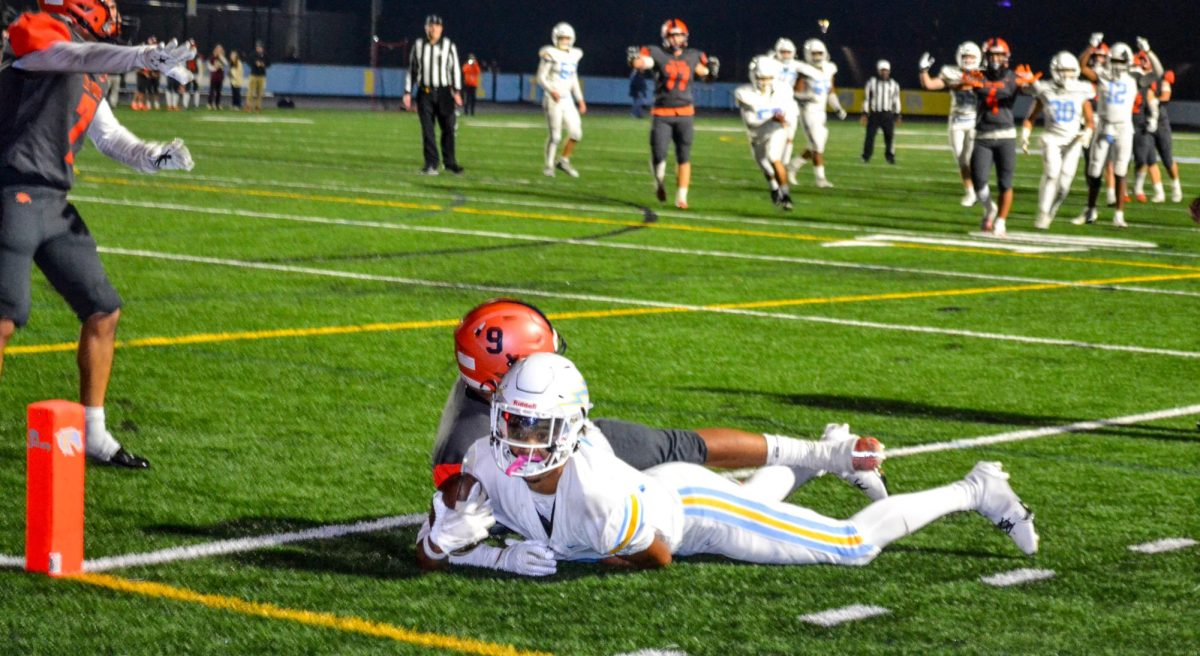 Al Honesty looks to the referee to see if his catch is good for a touchdown during the Homecoming game against Briar Woods.