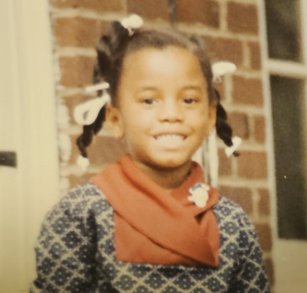 Dr. Felecia Lewis at five years old and ready to work.
Photo courtesy of Dr. Lewis.