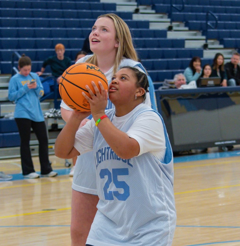 Ava Samson cheers as Keira Stafford takes a shot.