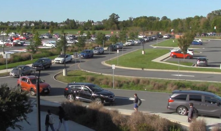 The line of cars waiting to pick up students at the end stretches from the front of the school into what seems like infinity.  