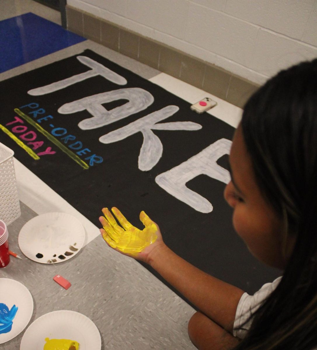 Junior Faith Ramirez works on promotional materials for the 2025 yearbook.  Photo courtesy of Lightridge Yearbook.