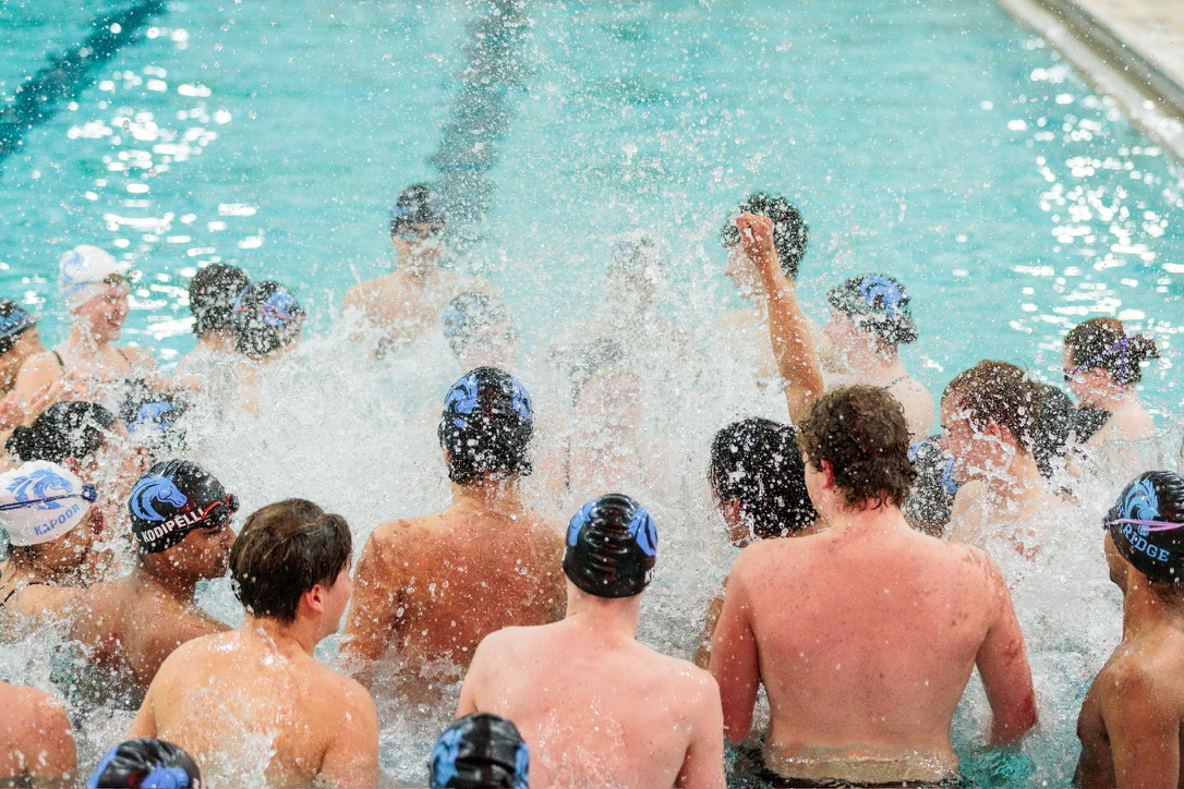 The swim team gets hyped up prior to the March 5 state championship meet.