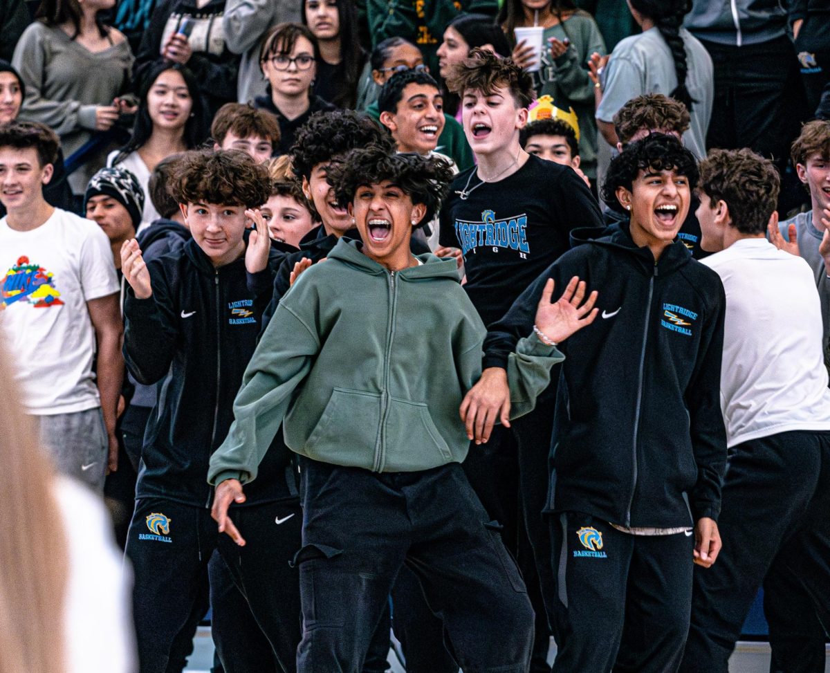 Freshmen Advay Boddu, Gavin Baldusare, Akshar Bangaru get hyped during the spring sports pep rally.  Unfortunately,  enthusiasm at pep rallies hasn't equated to attendance at games. 