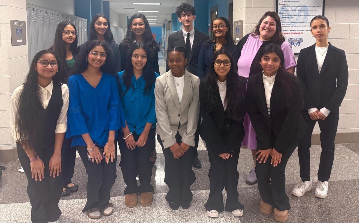 Lightridge's mock trial team poses after the first competition in school history. 
 Back row left to right: Aanya Mahendravadi, Reshma Bodduluru, Anna Kuruvilla, Suffar Mukhlus, Bethlehem Delelegn (captain), Mollie Safran (sponsor), Zeynep Bozkurt
Front row left to right: Sneha Vasabhaktula, Swetha Vasabhaktula, Lalitha Aravind (captain), Mia Smith, Sanvi Nanduri, Ashika Chavan

Photo courtesy of the Mock Trial team.
