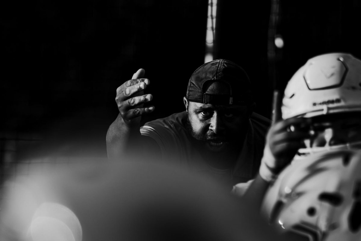 Defensive line coach Matthew Robinson gets the players ready.