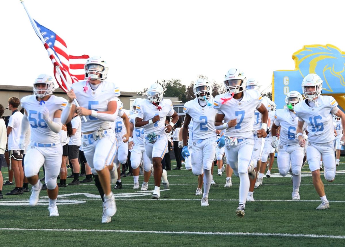 Senior Mason Aller leads the team into the field to start the 2025 Homecoming game.
Photo courtesy of Jay Bradshaw and the Lightridge Marching Storm.