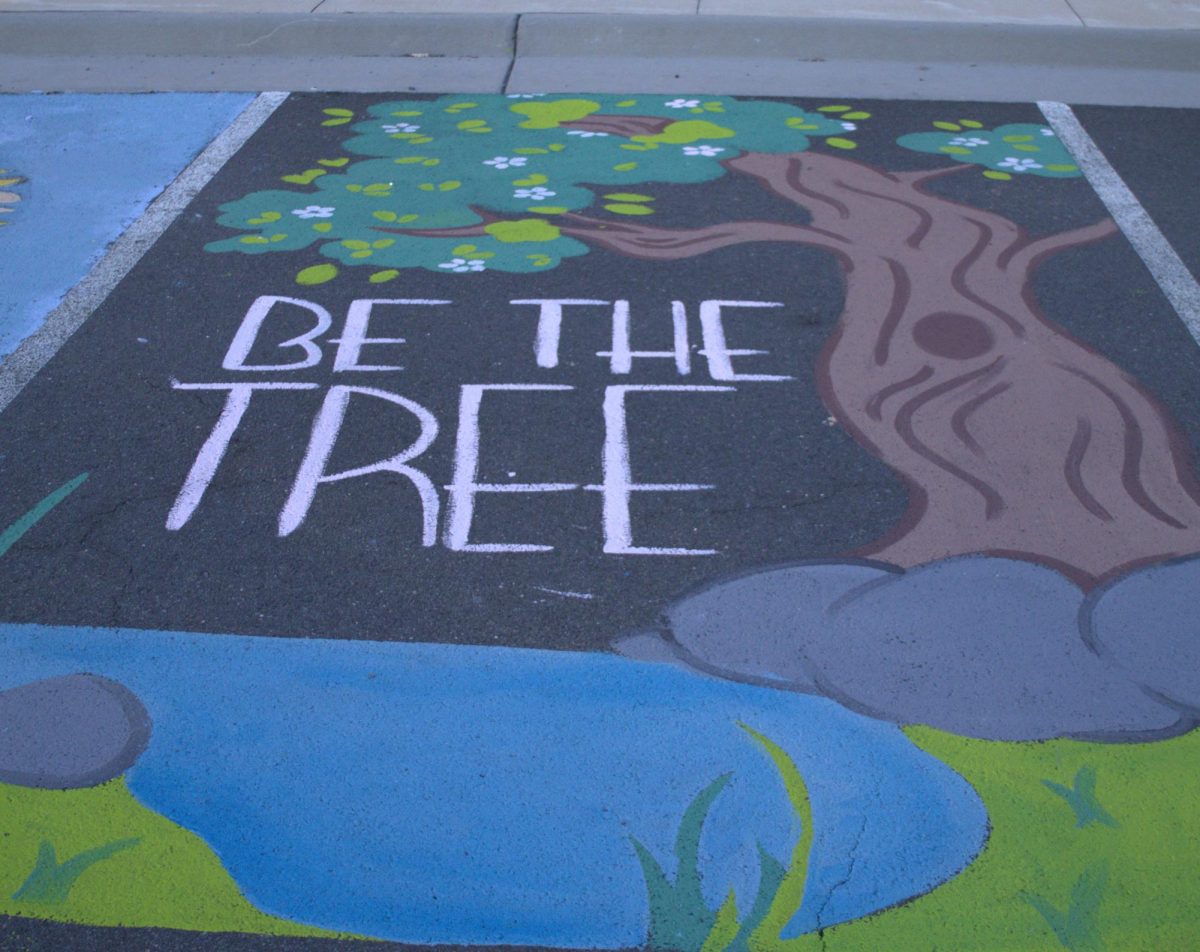 Art students took to the faculty lot to paint teacher spots and raise money for the Art Honor Society.